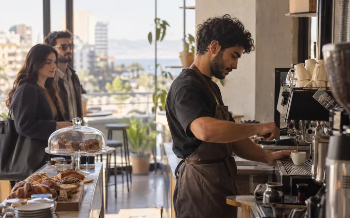 A barista pulling an espresso shot at a specialty coffee counter
